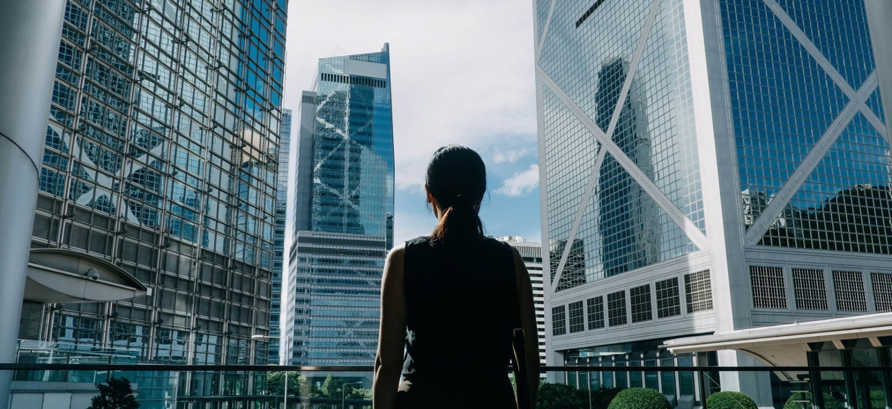 woman looking at office buildings
