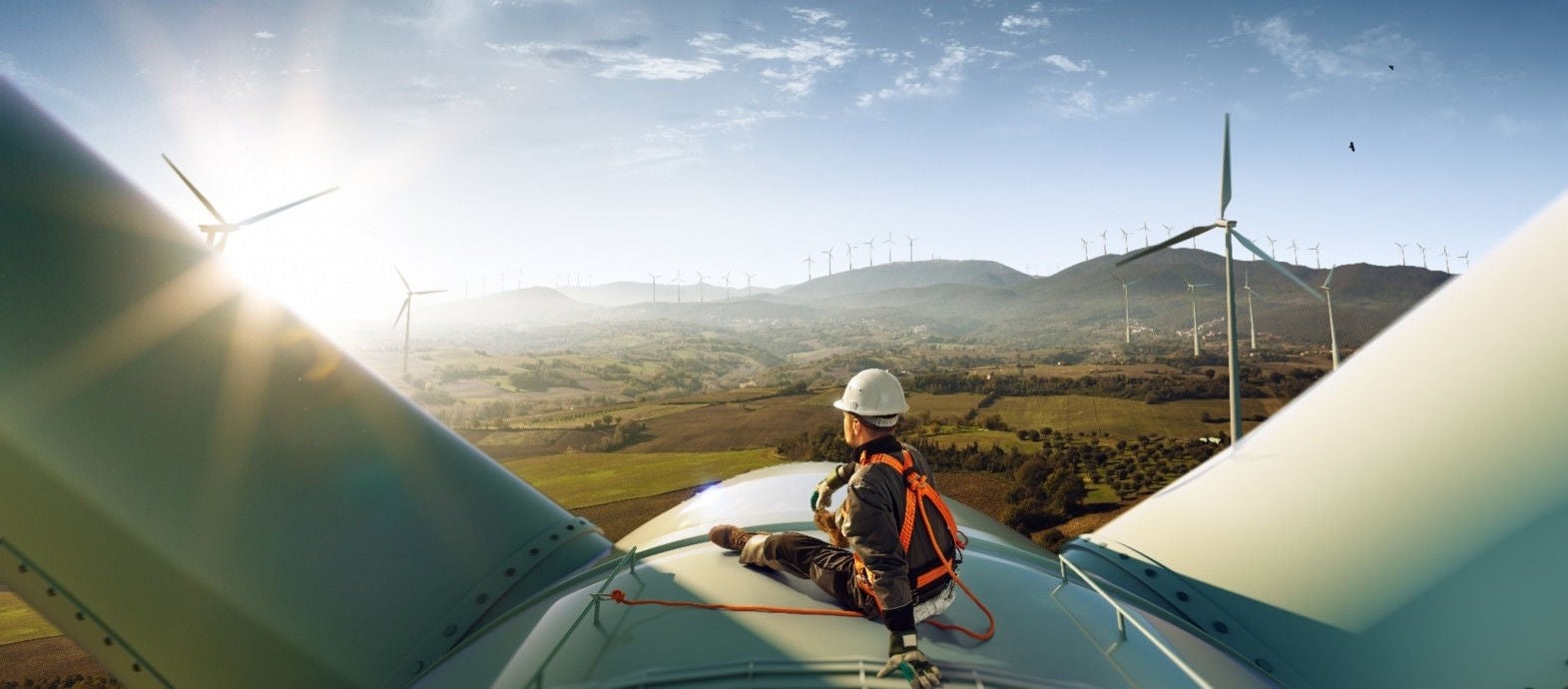 man-sitting-on-windmill